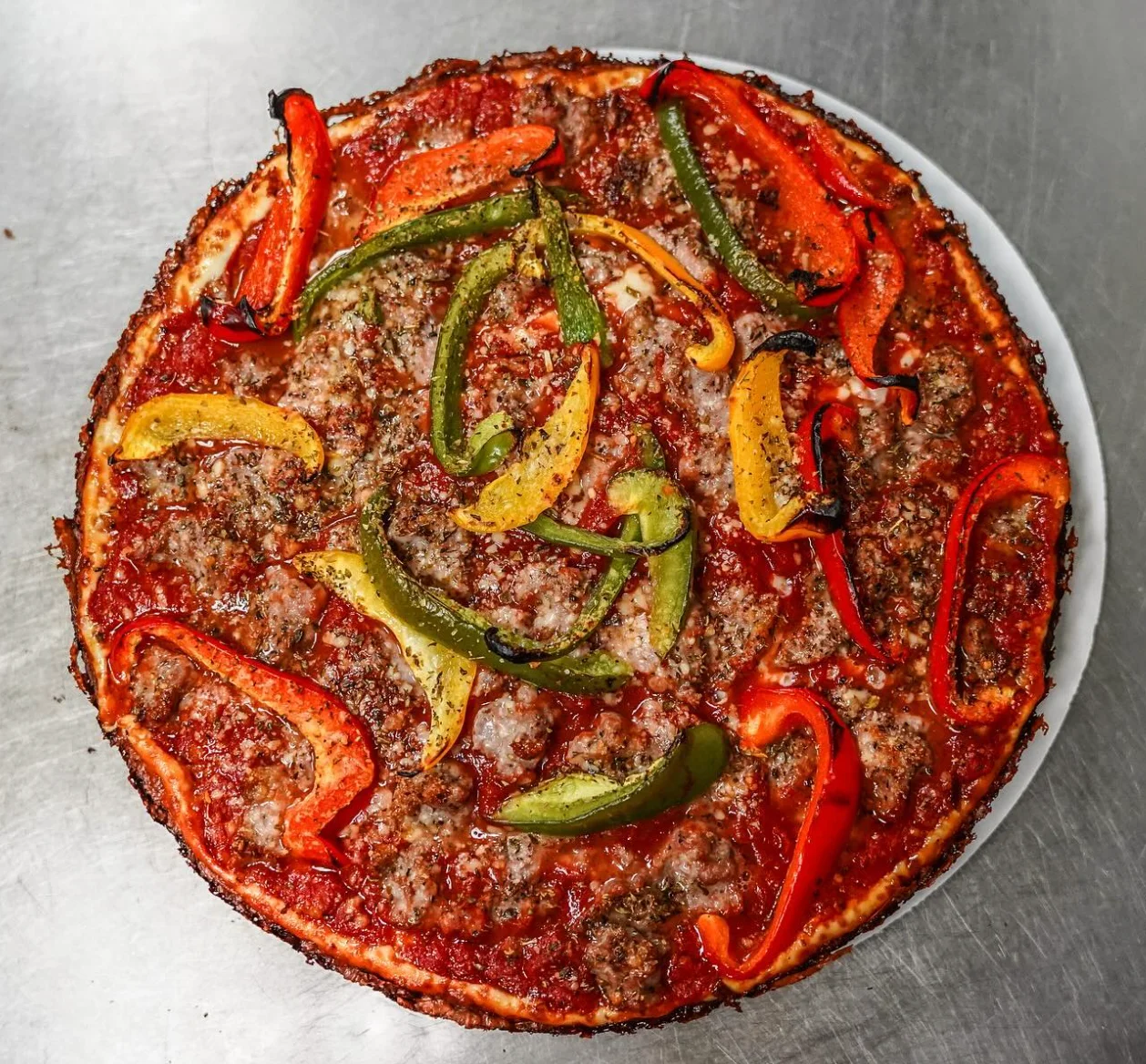 Italian sausage and pepper pizza with a crispy crust