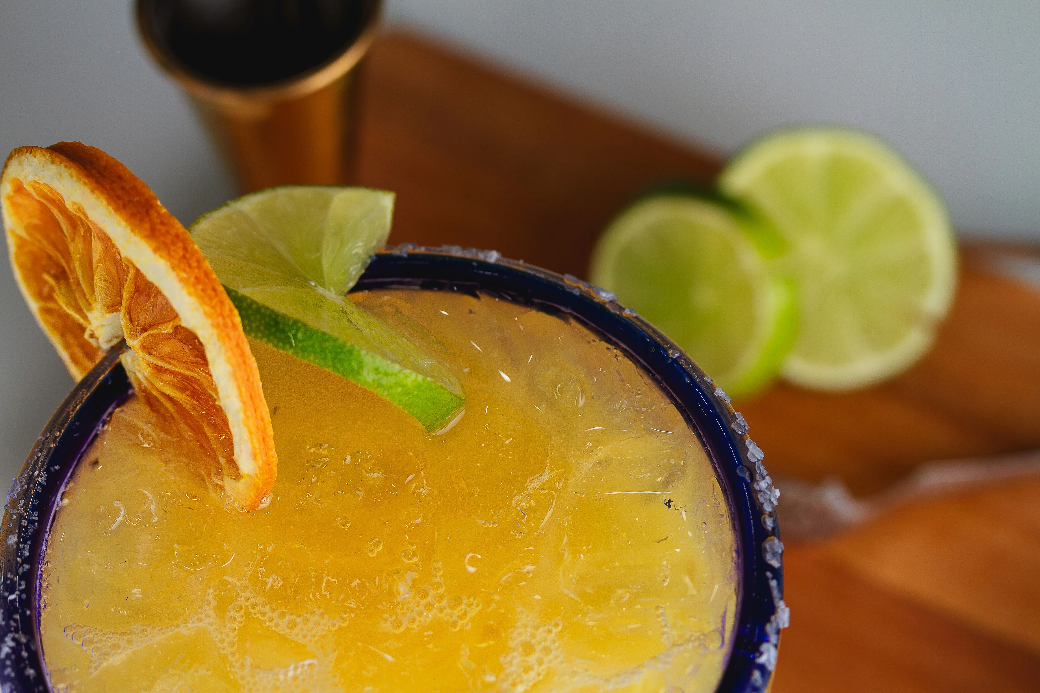 Refreshing margarita cocktail with citrus garnishes