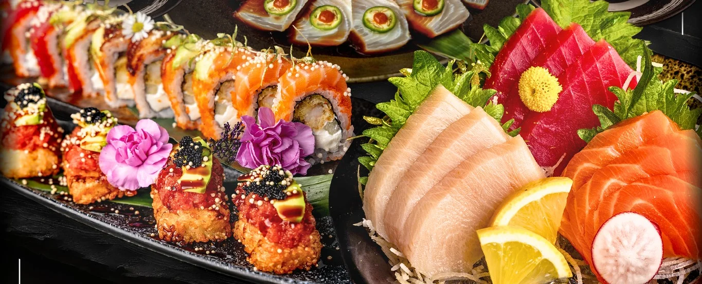 Sushi platter featuring assorted Japanese sushi and sashimi