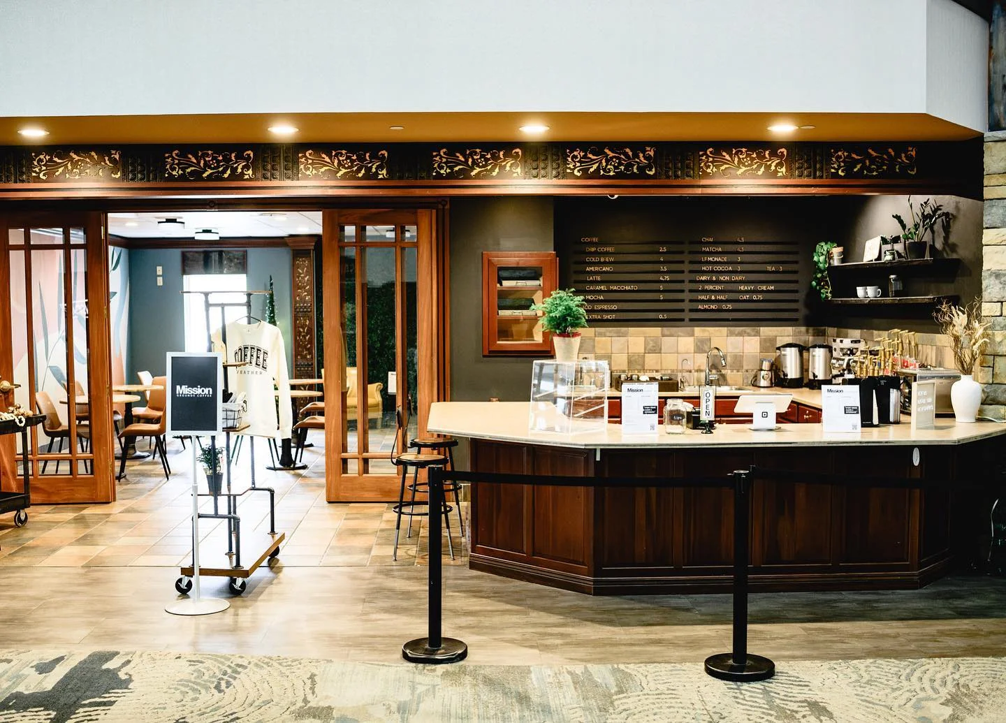 Cozy coffee shop interior with a welcoming counter and seating area