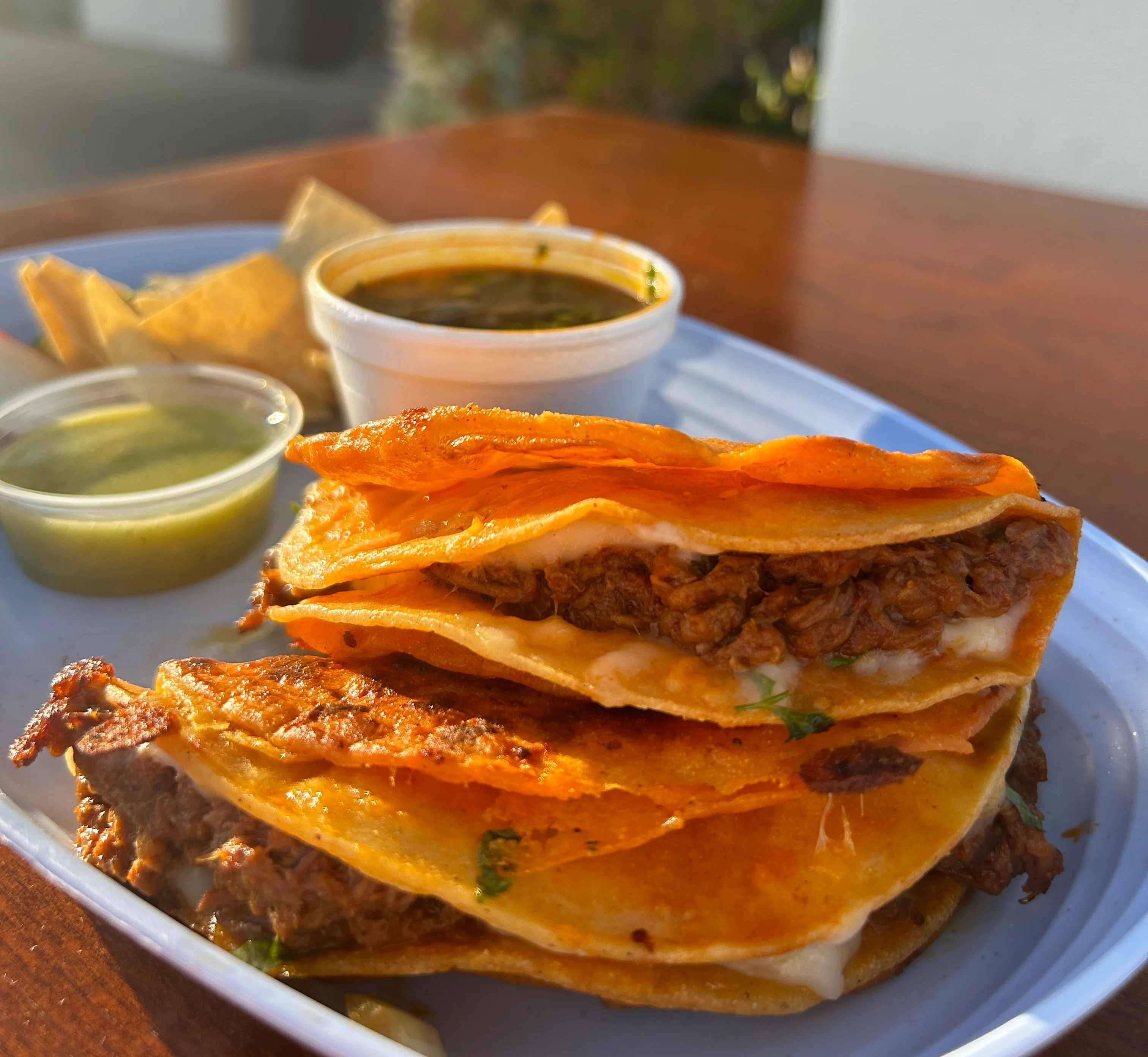 Crispy beef tacos with cheese and salsa