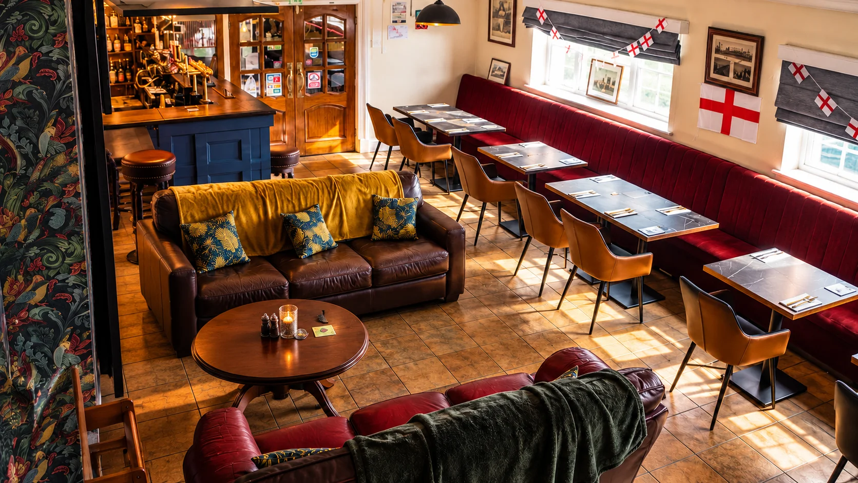 Bright English pub dining room with red banquette seating and traditional decor