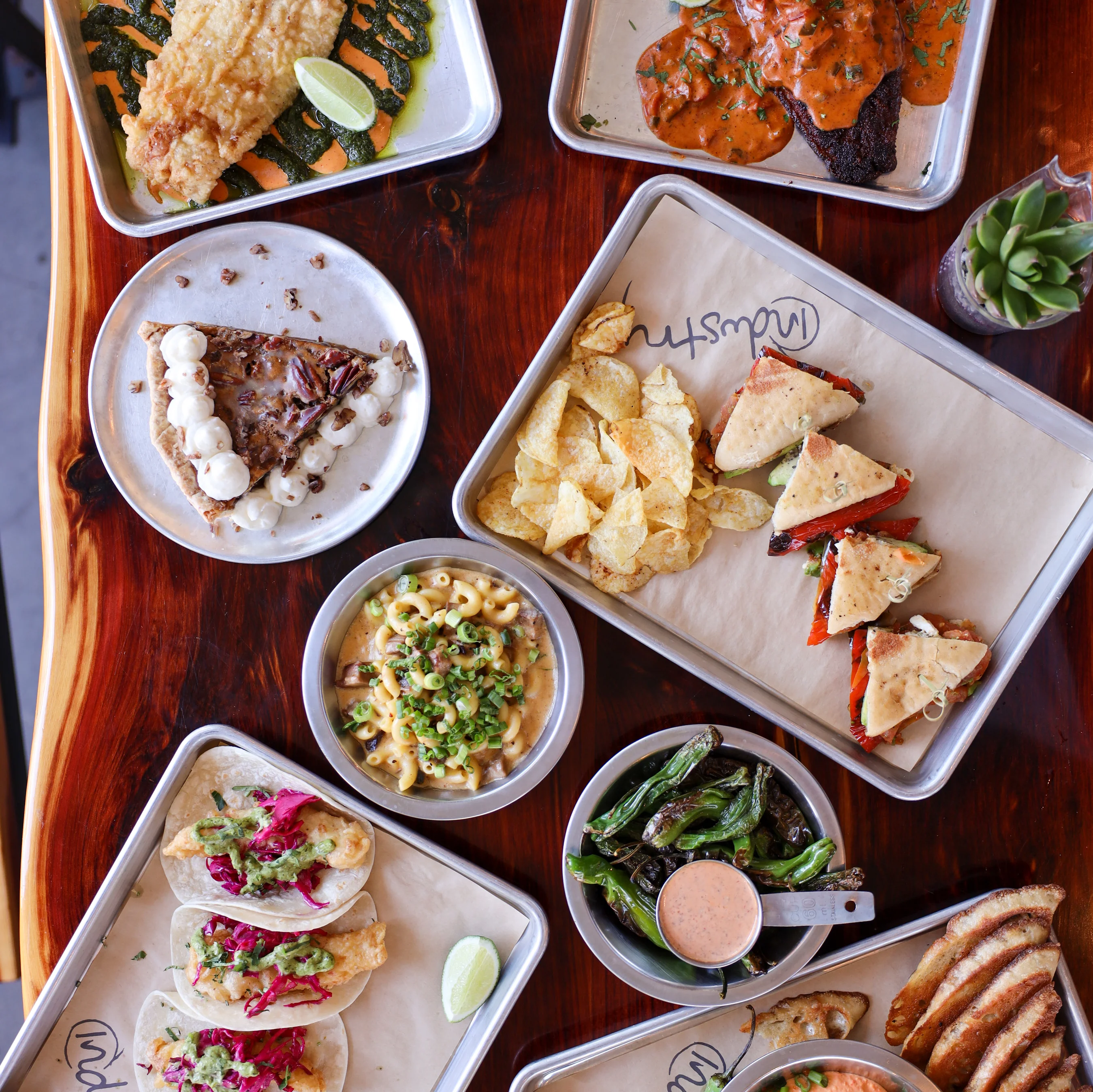 Assorted Mexican dishes including tacos and fish fillet