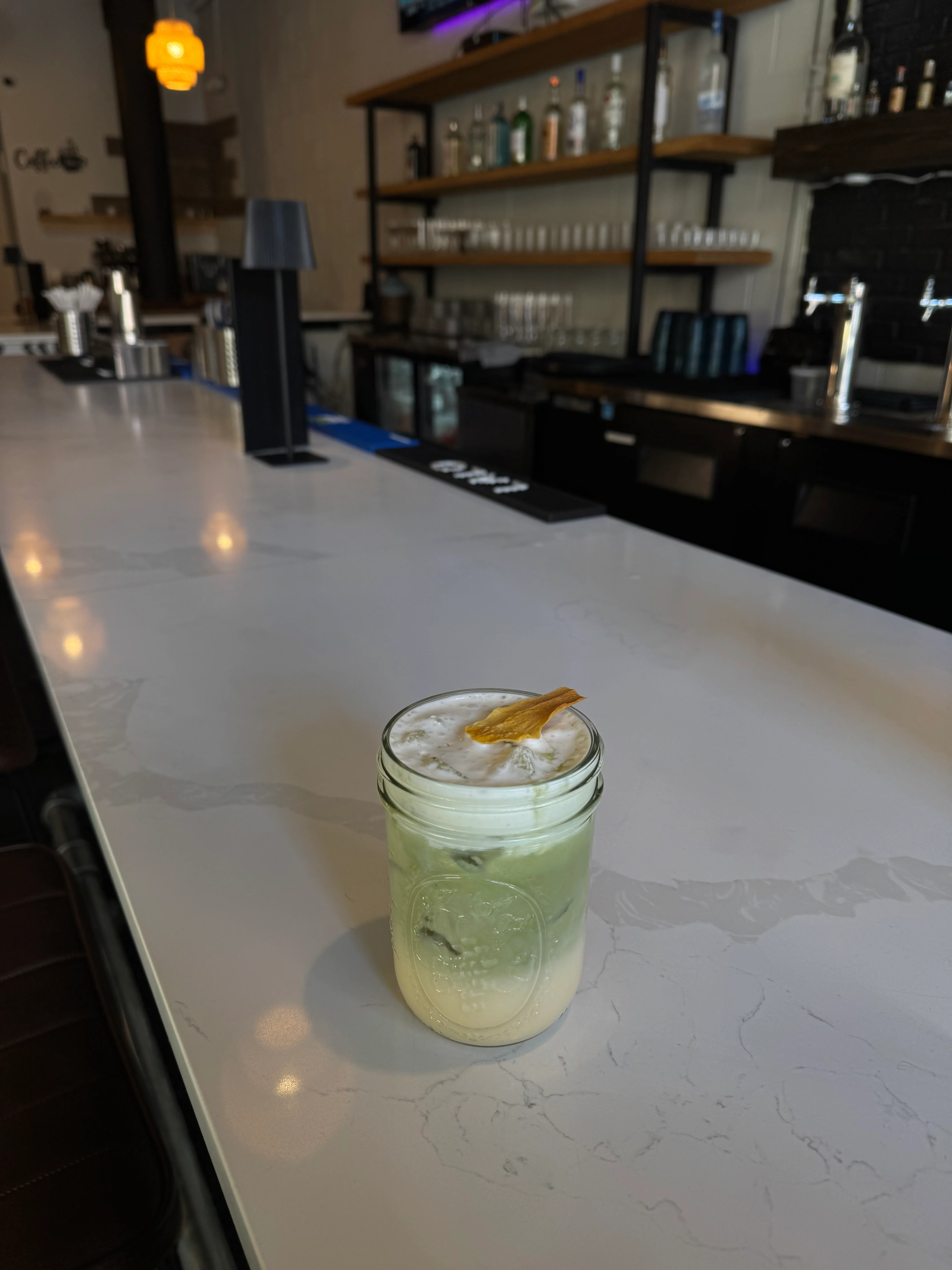 Refreshing matcha latte served in a mason jar