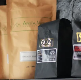 Coffee bags on display in a cozy café