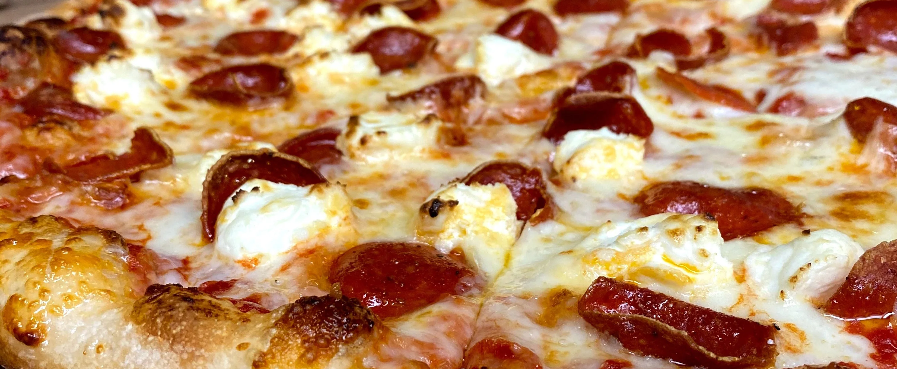 Pepperoni pizza with melted cheese and crispy crust