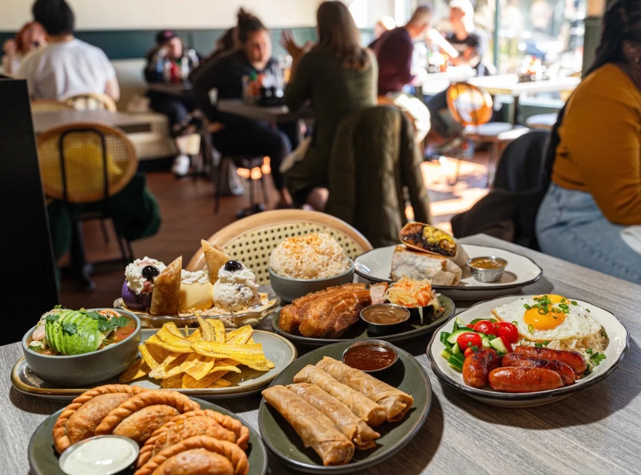 Assorted Latin American dishes served in a vibrant restaurant setting