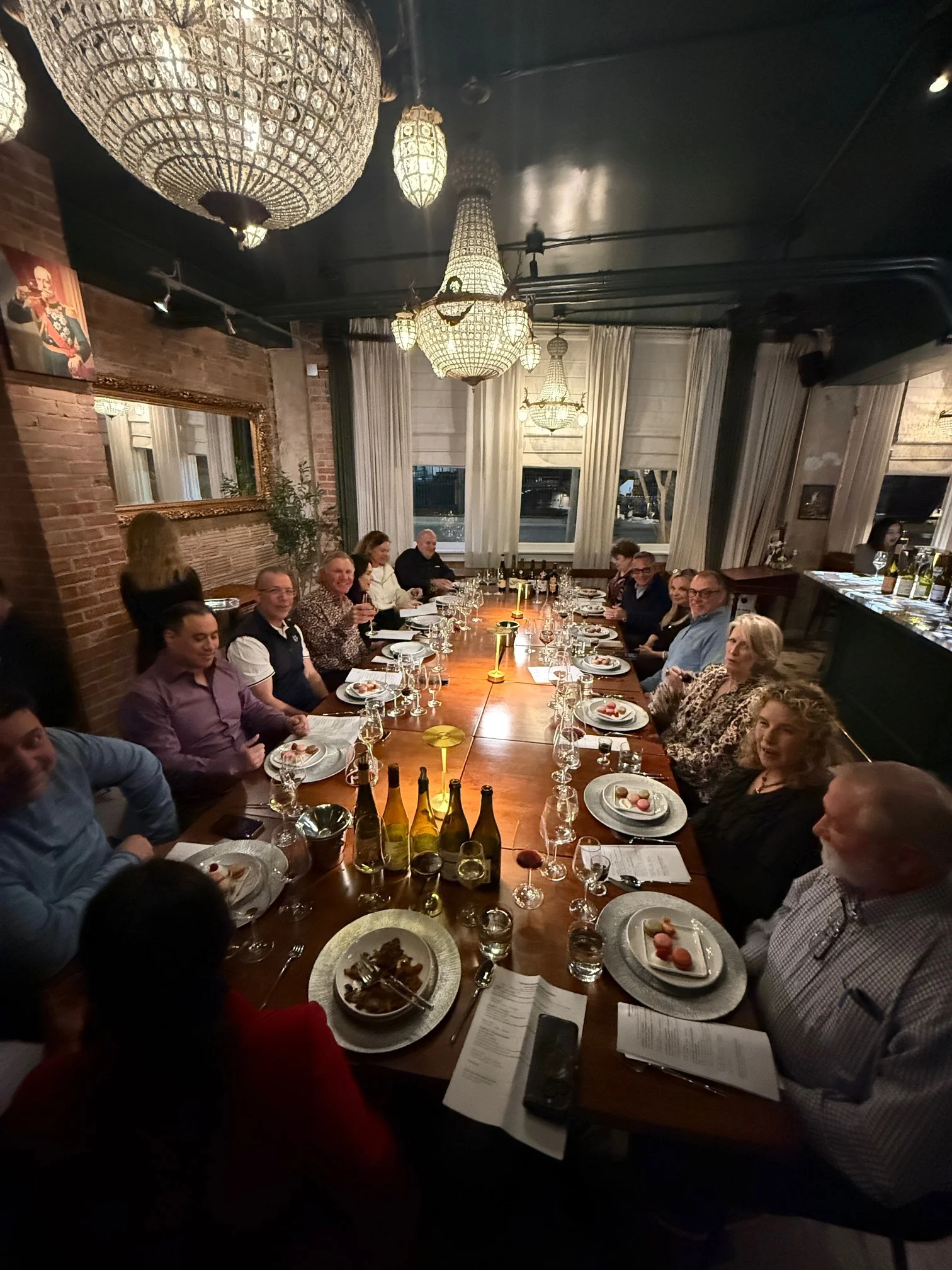 Elegant dining setting with guests enjoying a gourmet meal