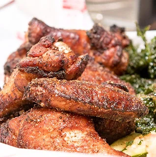 Crispy Southern-style fried chicken wings with greens