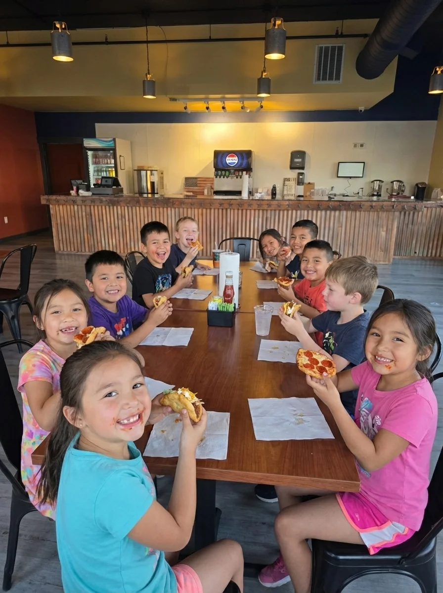 Children enjoying pizza in a vibrant restaurant setting