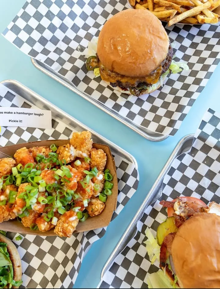Juicy cheeseburger with crispy fries and loaded tater tots