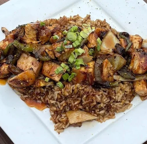 Szechuan chicken stir-fry served over rice
