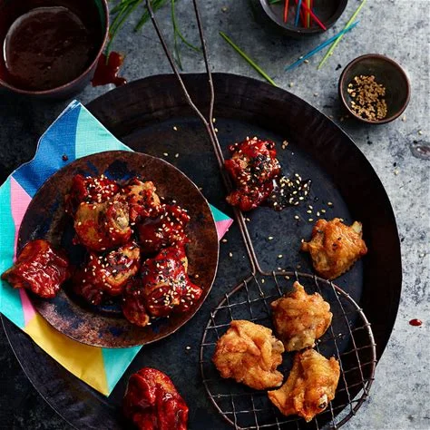 Crispy Korean fried chicken with sweet sauce and sesame seeds