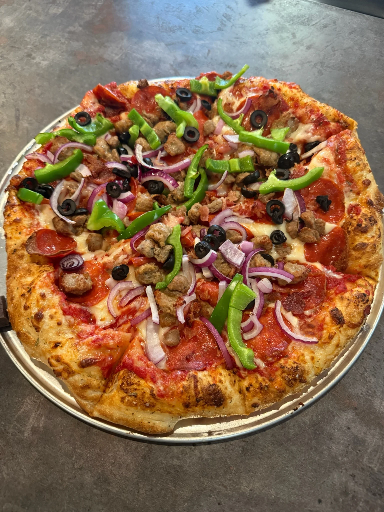 Loaded meat lover's pizza with fresh toppings