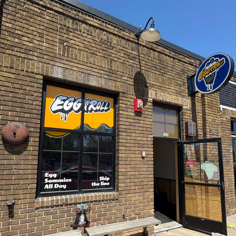 Exterior of Egg & Roll restaurant with vibrant signage