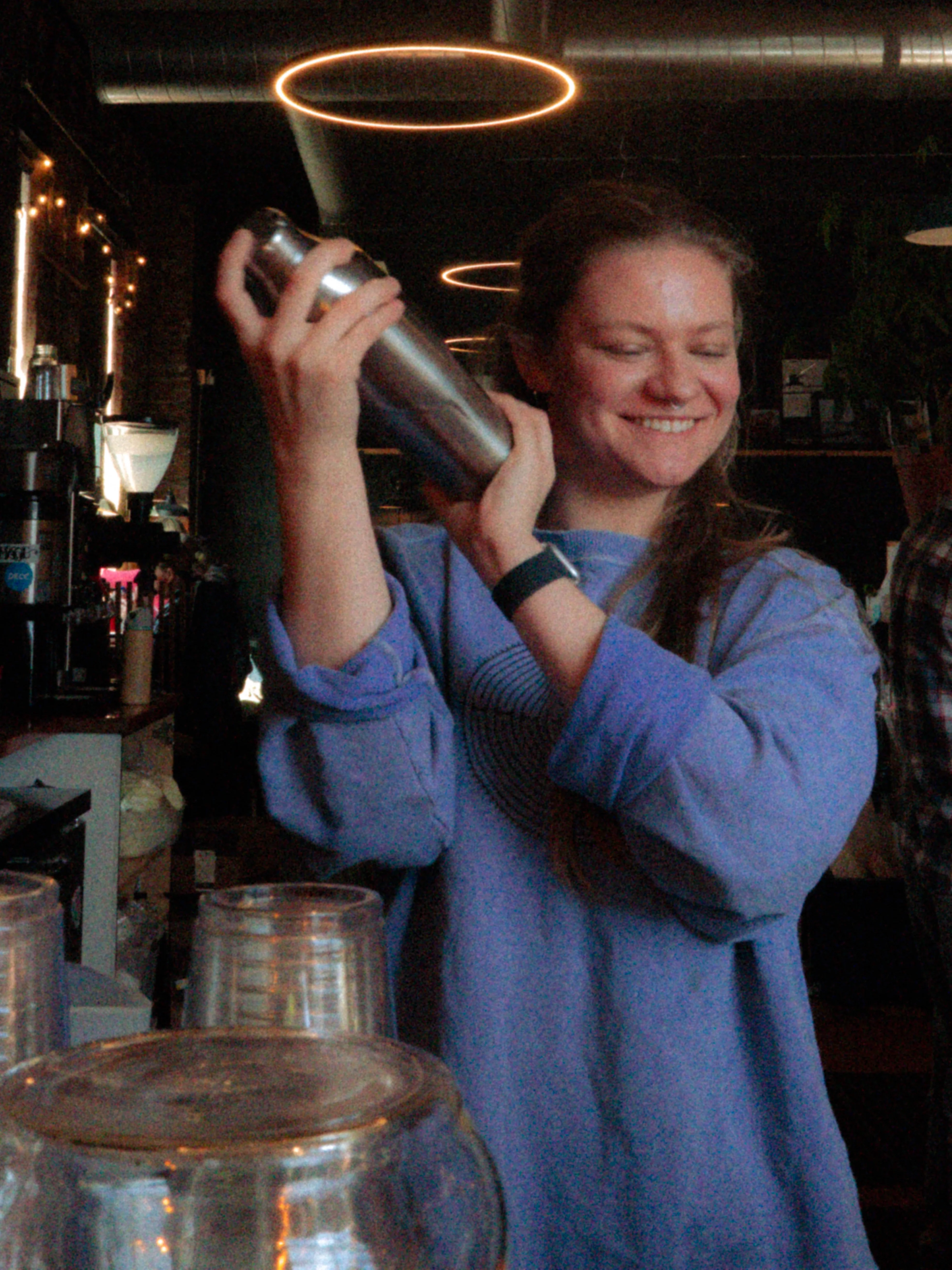 Bartender shaking a cocktail at a trendy bar