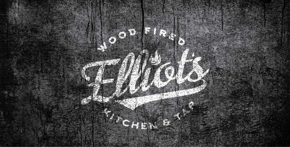 A rustic wooden background featuring a stylized logo that reads 'Elliot's Wood Fired Kitchen & Tap'.