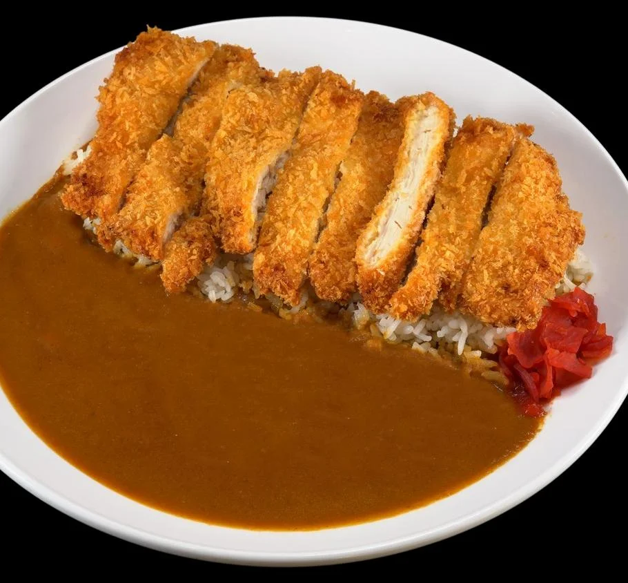 Japanese katsu curry served with rice and pickled vegetables