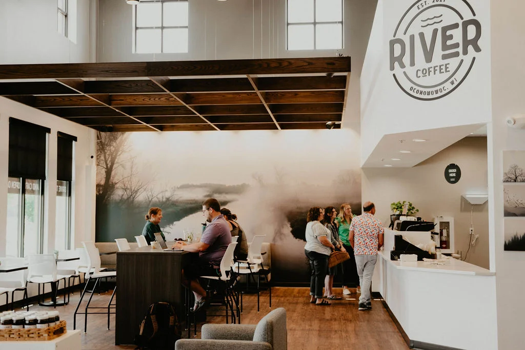 Modern coffee shop interior with cozy seating and natural light