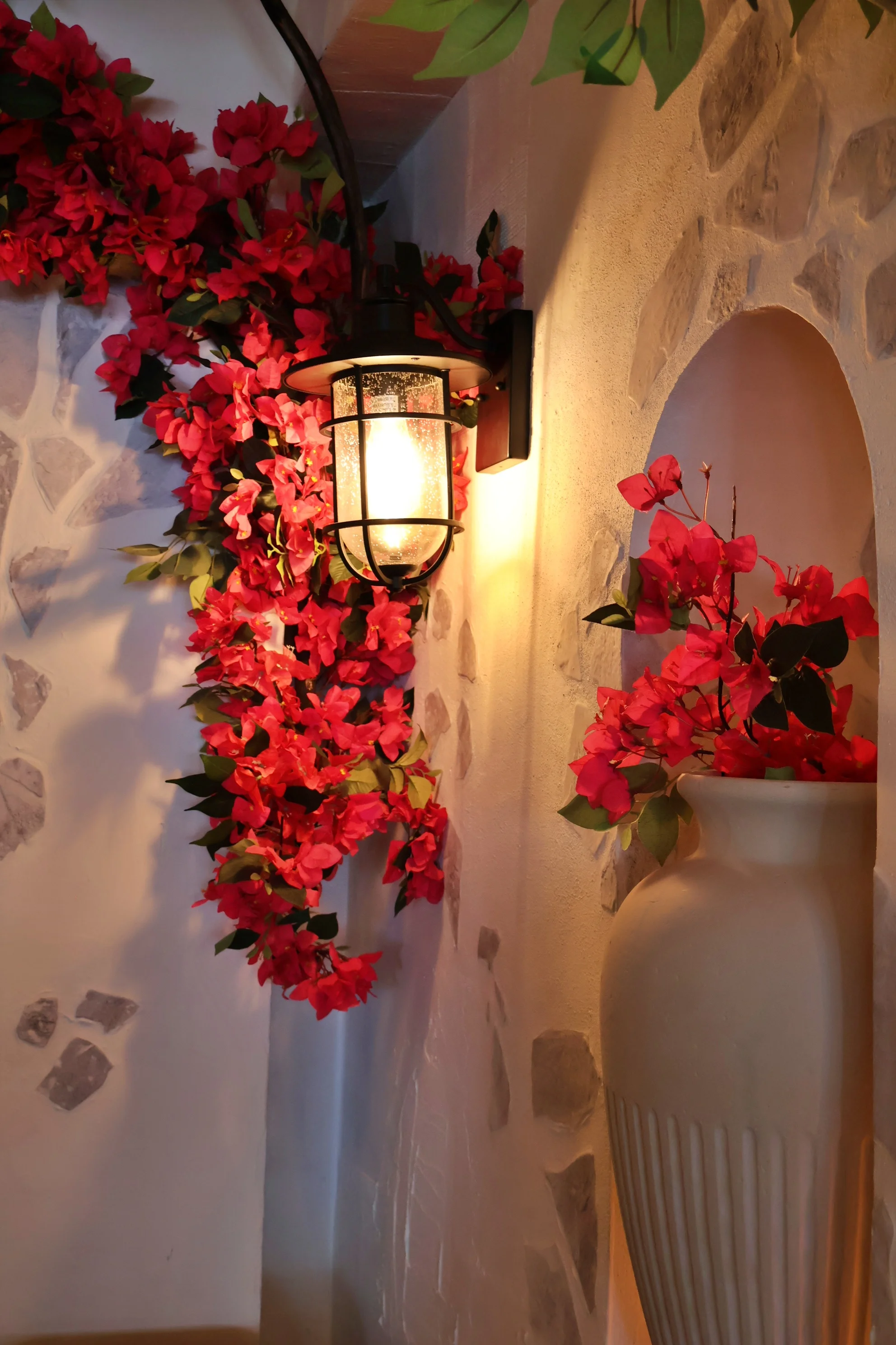Cozy restaurant corner with floral decor and warm lighting