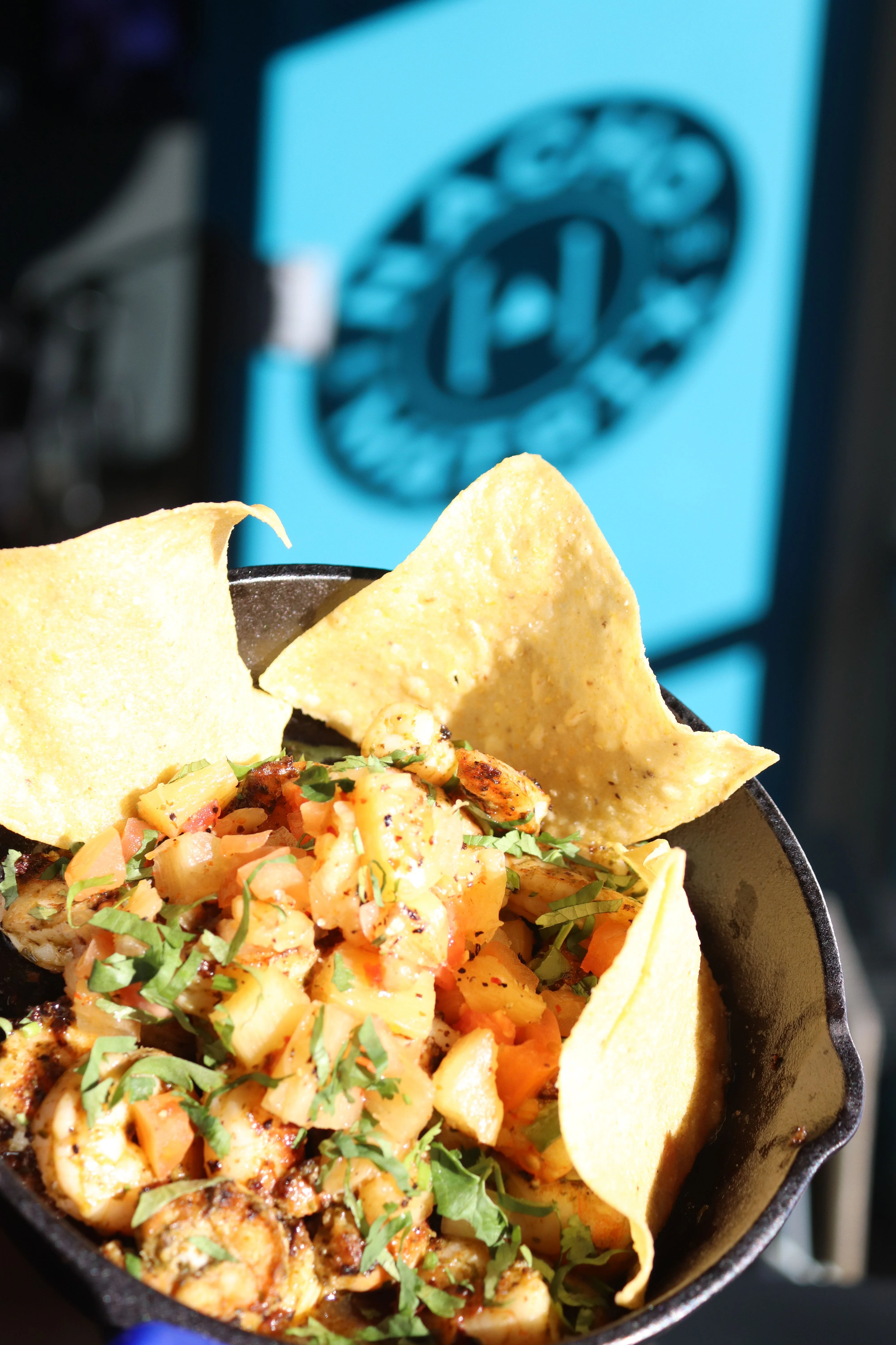 Shrimp ceviche with tortilla chips in a cast iron skillet