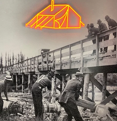 Historical photo of U.S. Deputy Marshals inspecting liquor barrels
