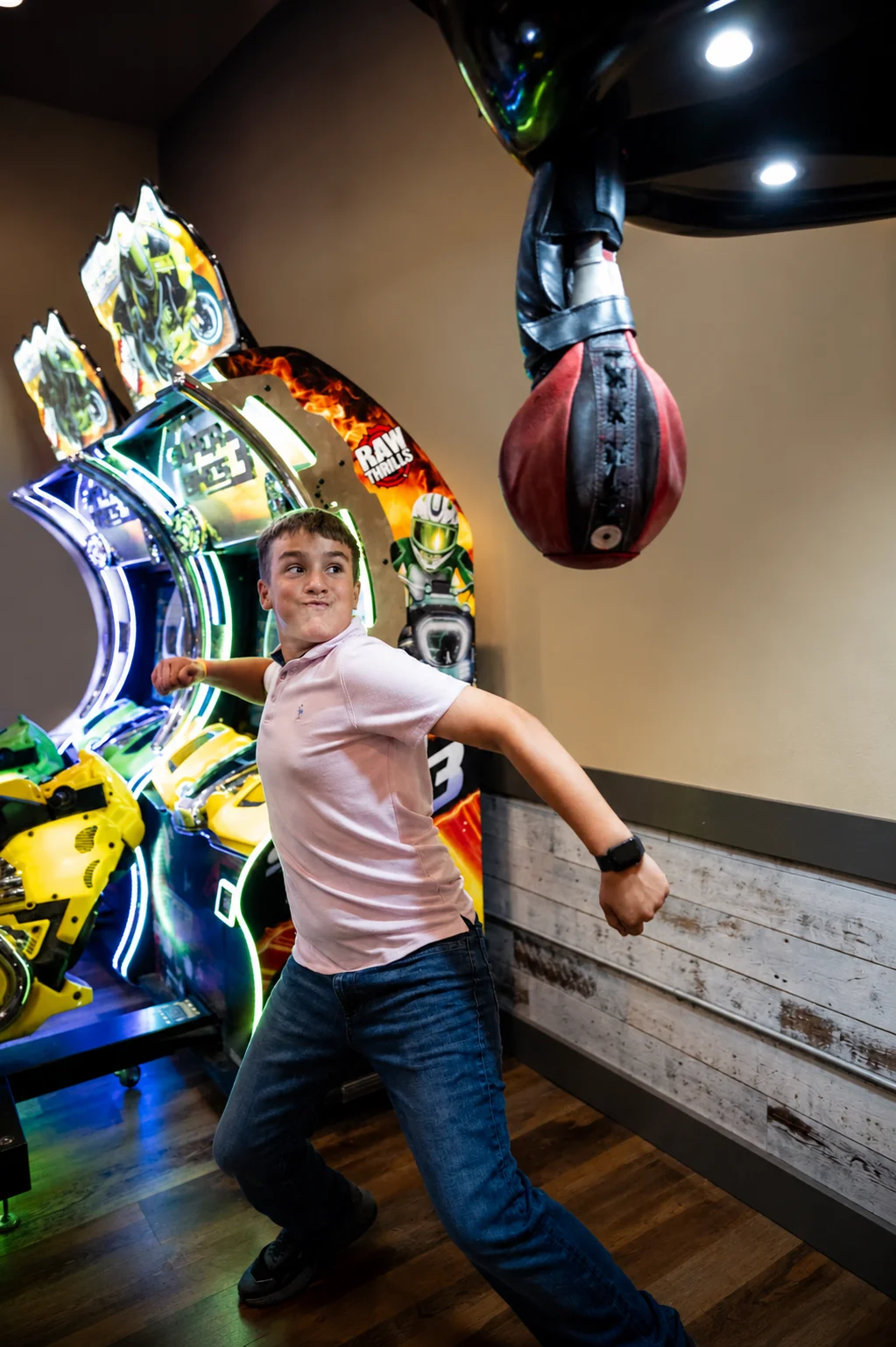 boy punching boxing arcade game