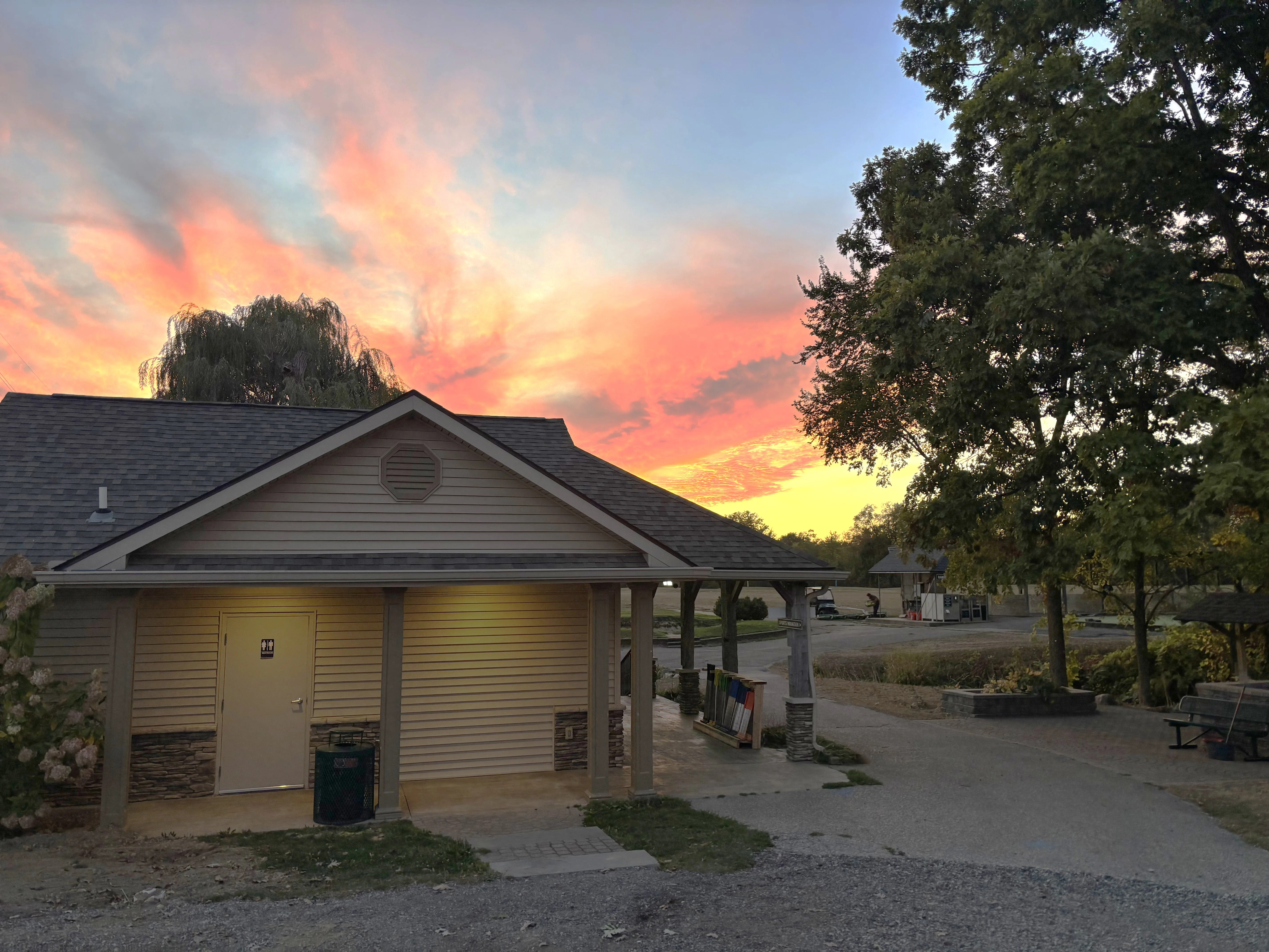 Scenic sunset view over a park building with vibrant colors