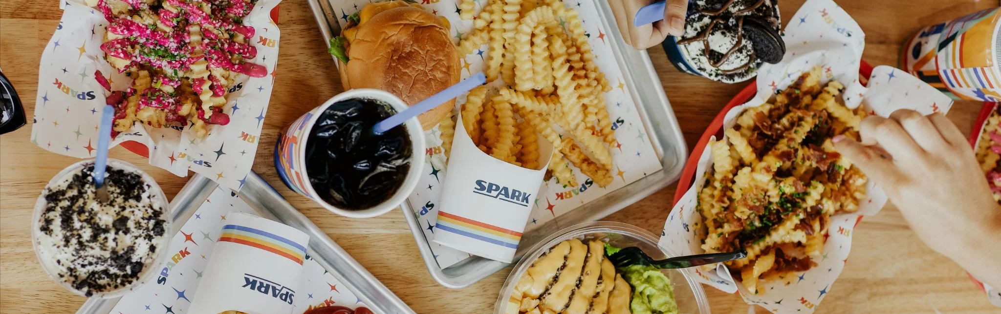 Colorful loaded fries and burger in a casual dining setting