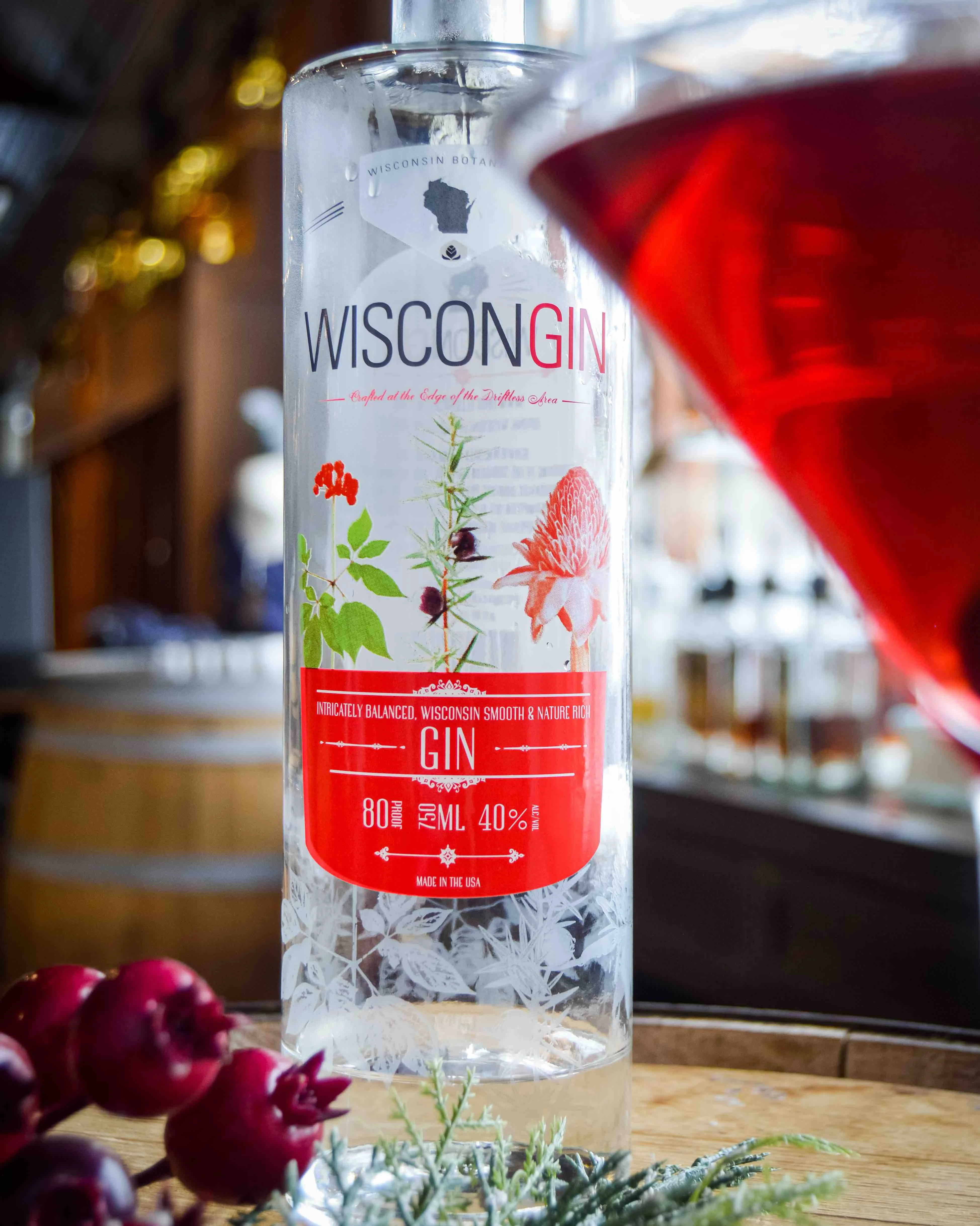 WisconGin bottle with some berries and a martini