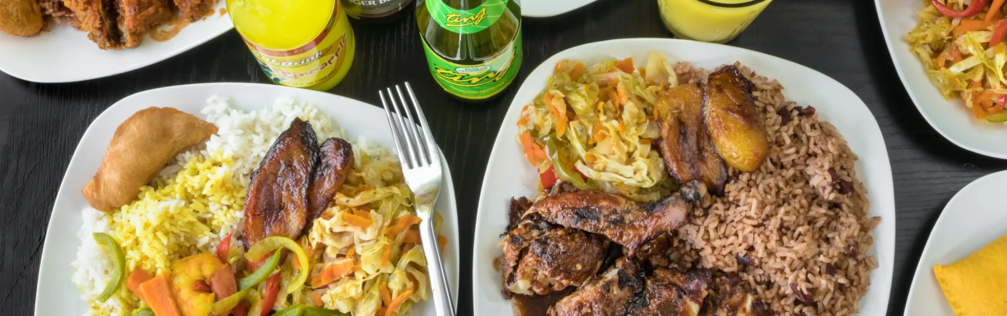 Jamaican jerk chicken with rice and peas, served with vegetables
