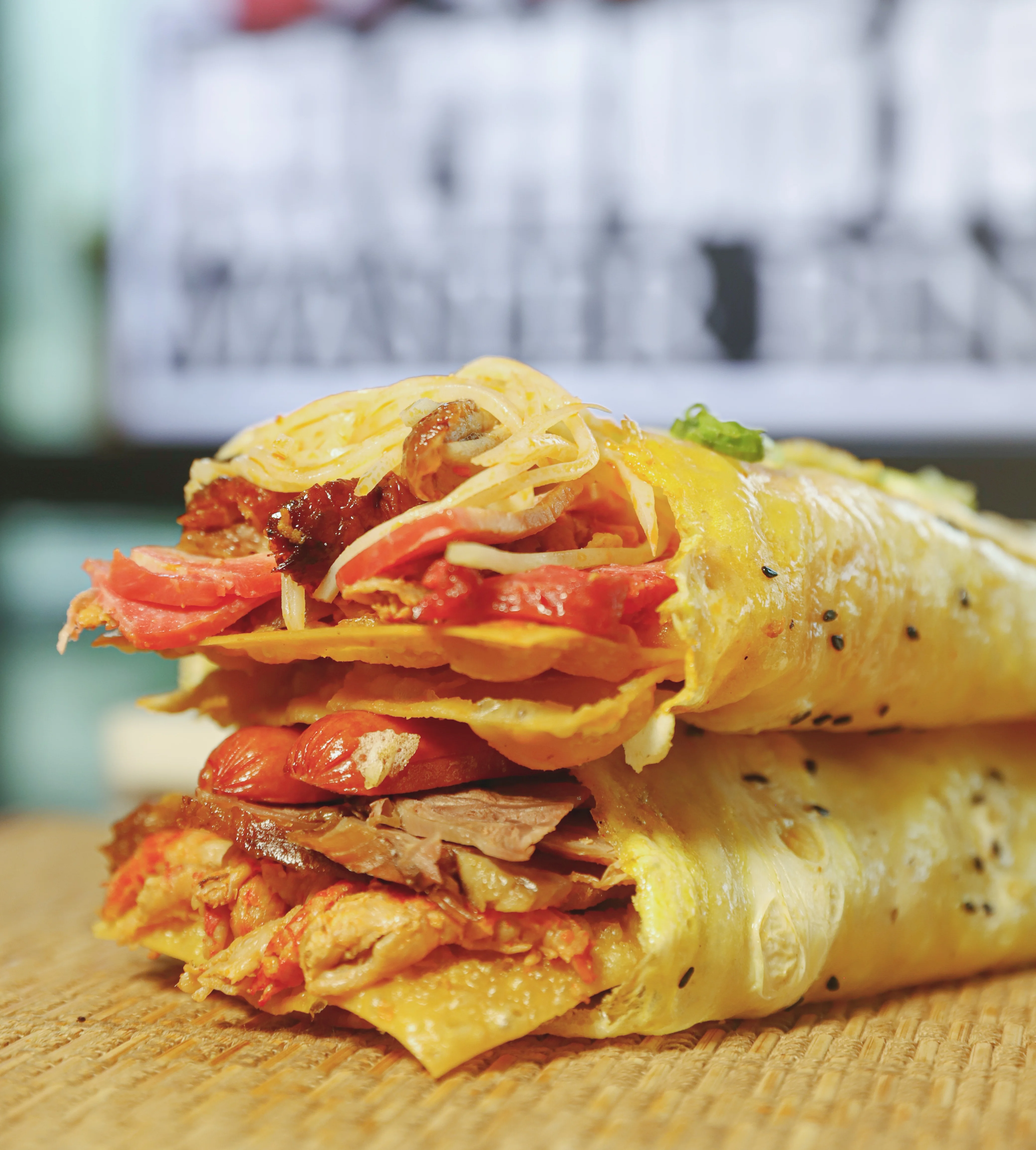 Delicious Mexican burrito filled with meats and toppings