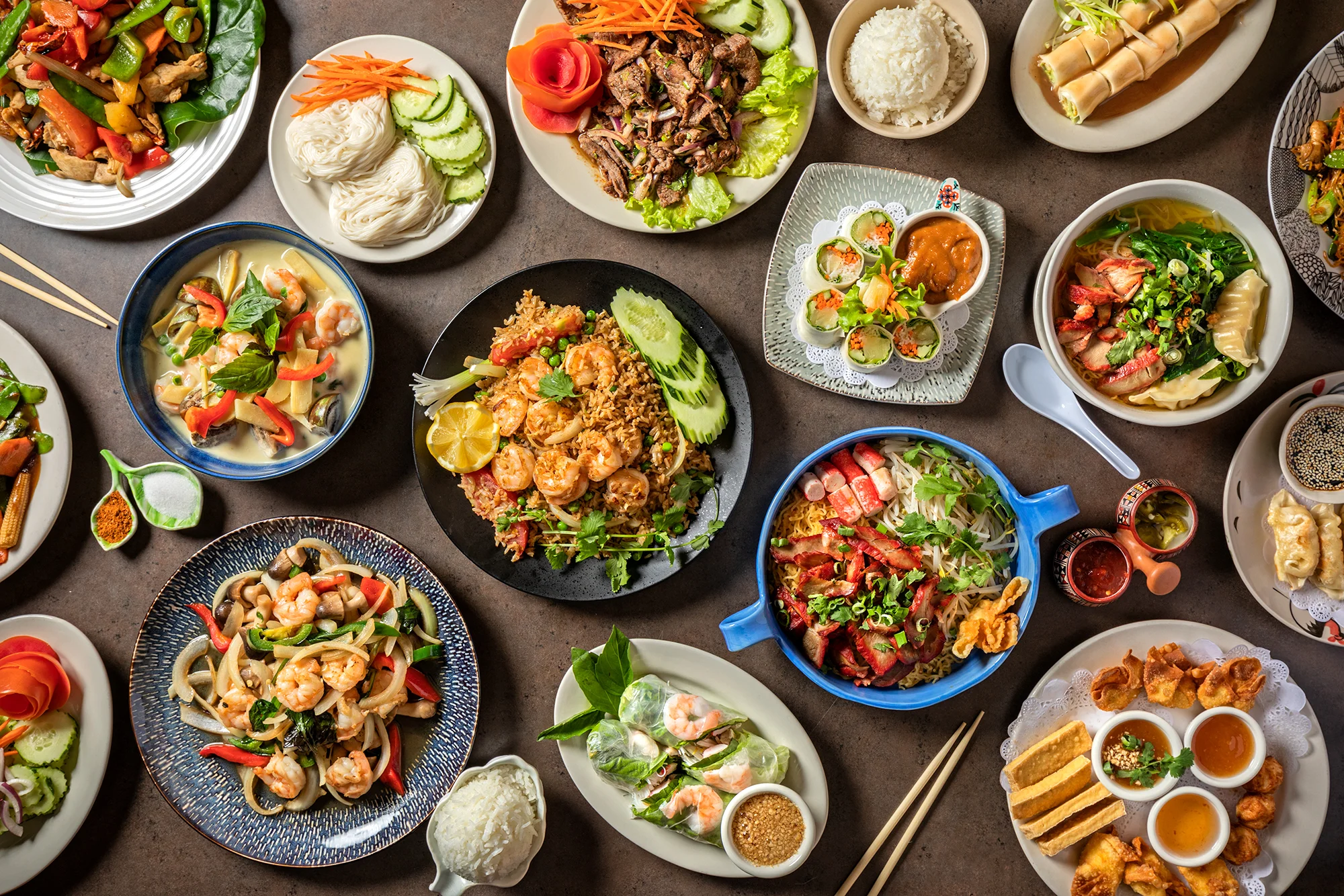 Assorted Asian dishes including pho and fried rice