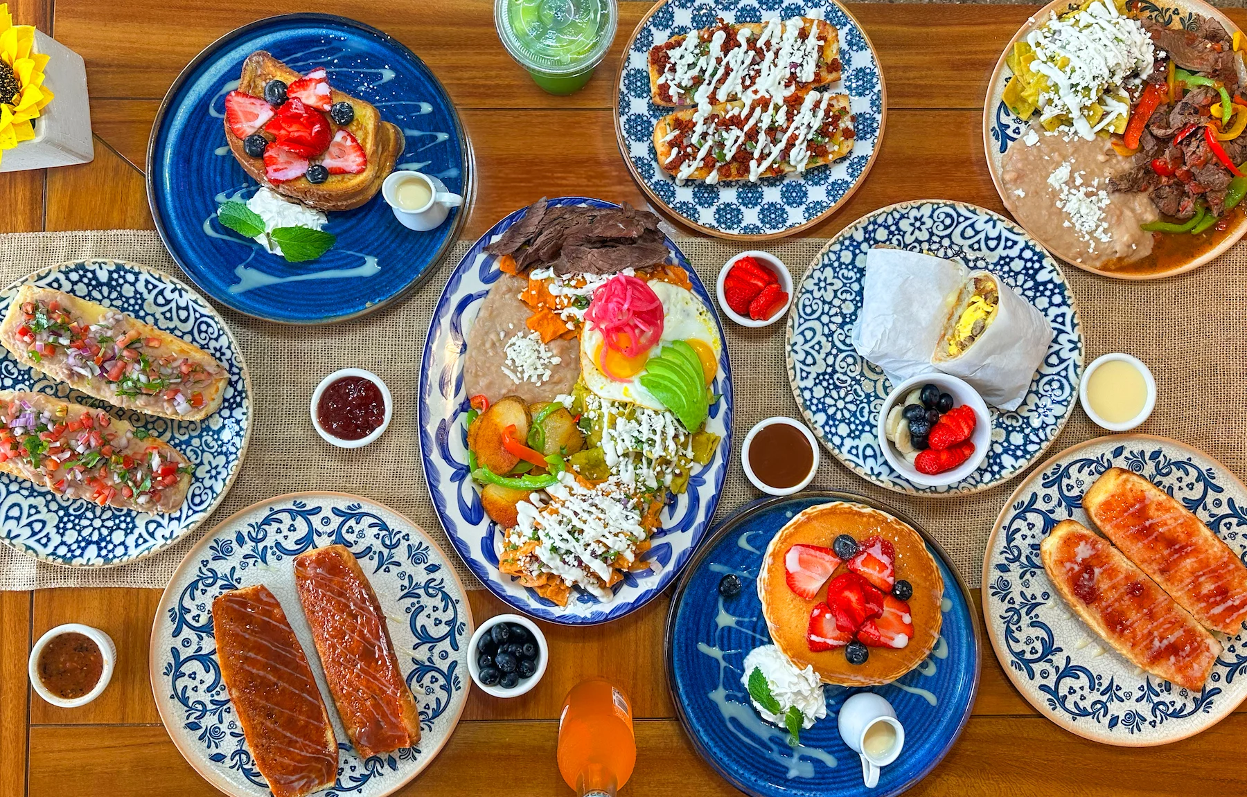 Colorful Mexican breakfast spread with tacos and pancakes