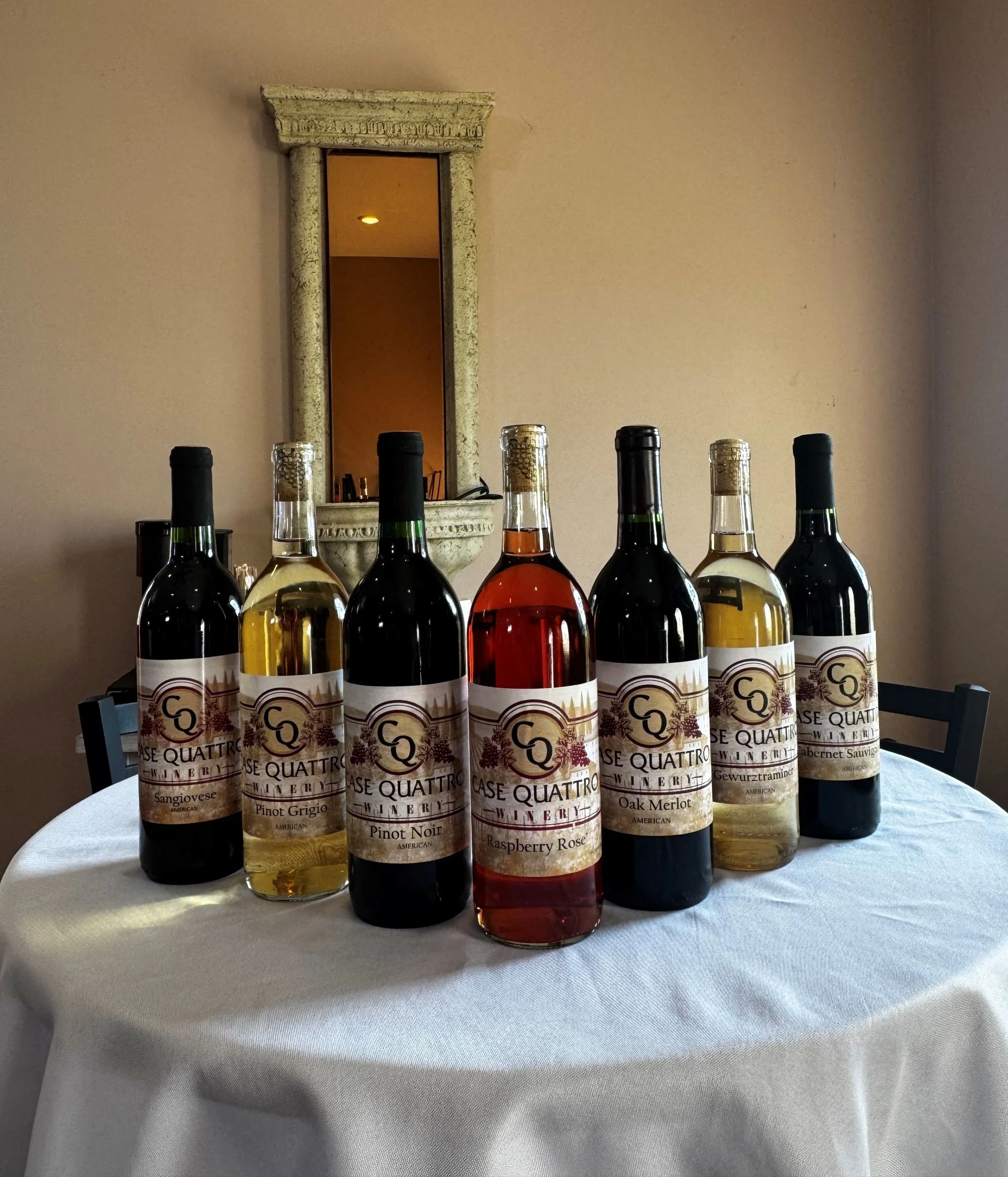 Selection of wines from Case Quattro Winery on a table
