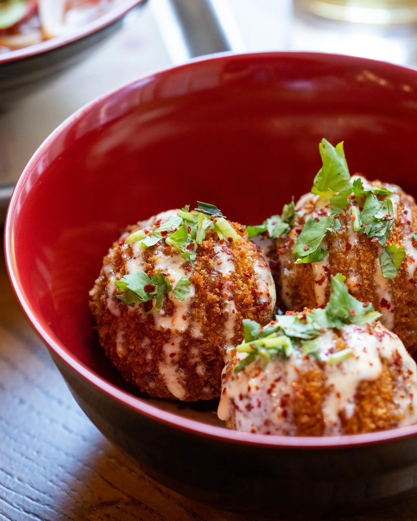 Crispy Indian dahi puri topped with yogurt and spices