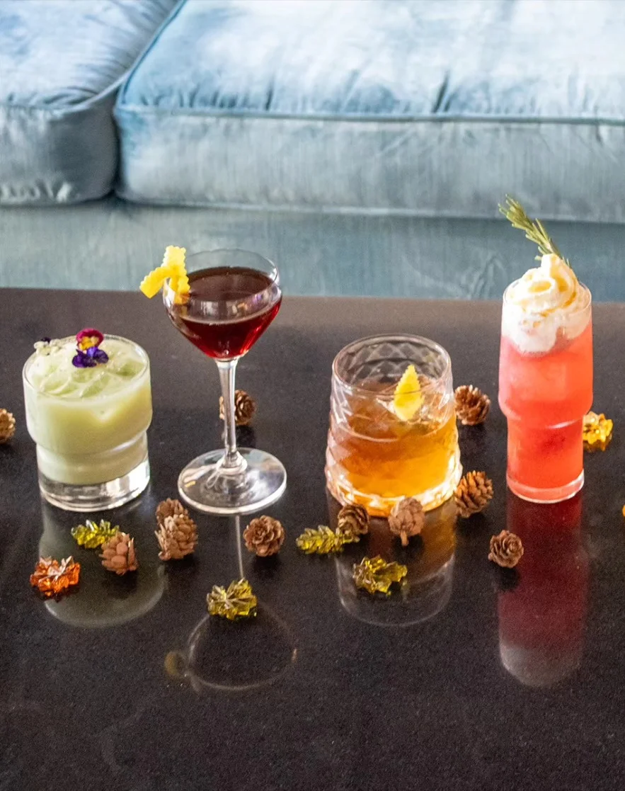 Colorful array of crafted cocktails on a sleek bar counter
