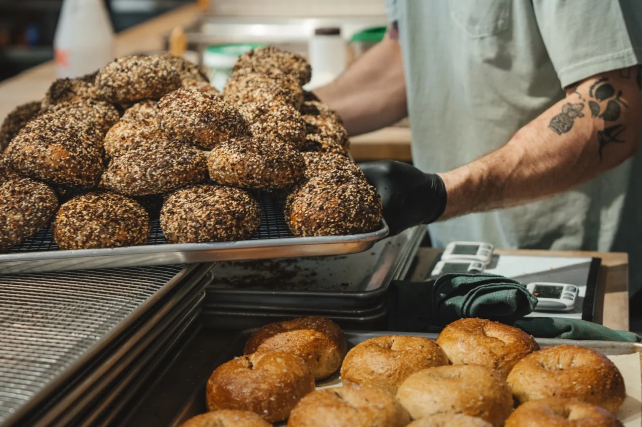 Freshly baked bagels on a cooling rack
