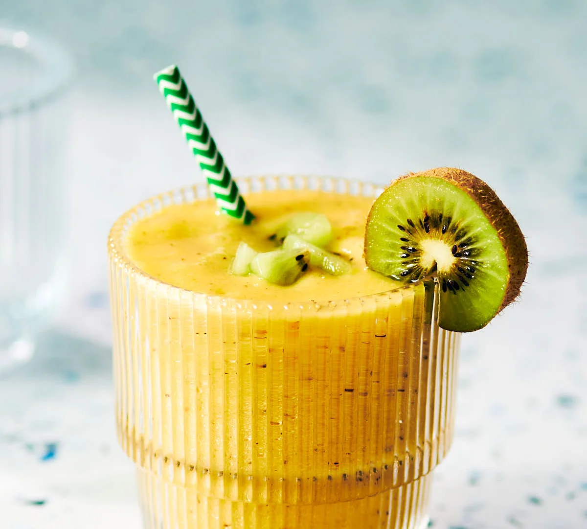 Tropical smoothie with kiwi and mango in a glass