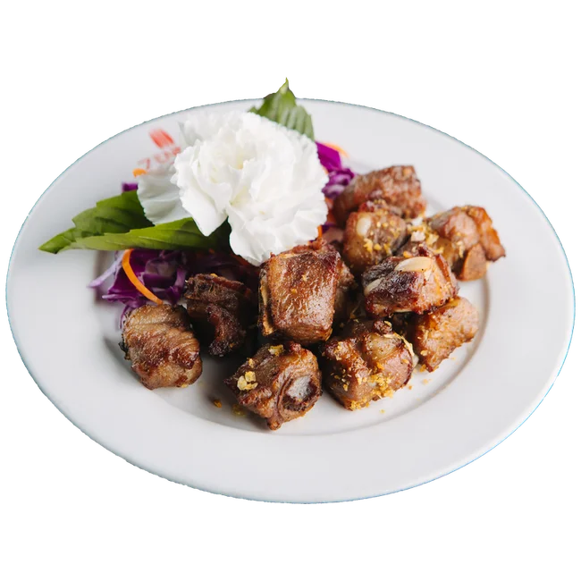 Crispy Vietnamese fried pork belly with herbs and garnish