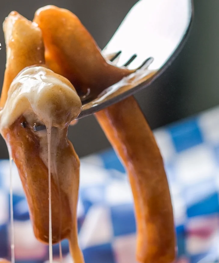Delicious poutine topped with cheese curds and gravy