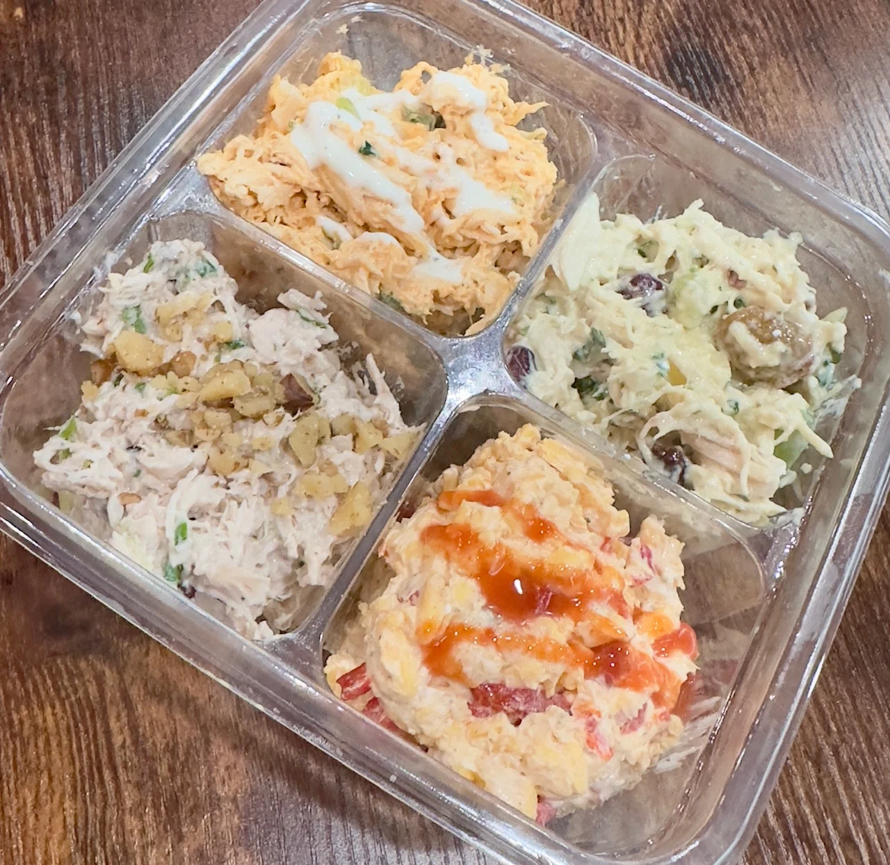 Assorted chicken salads in a deli-style platter