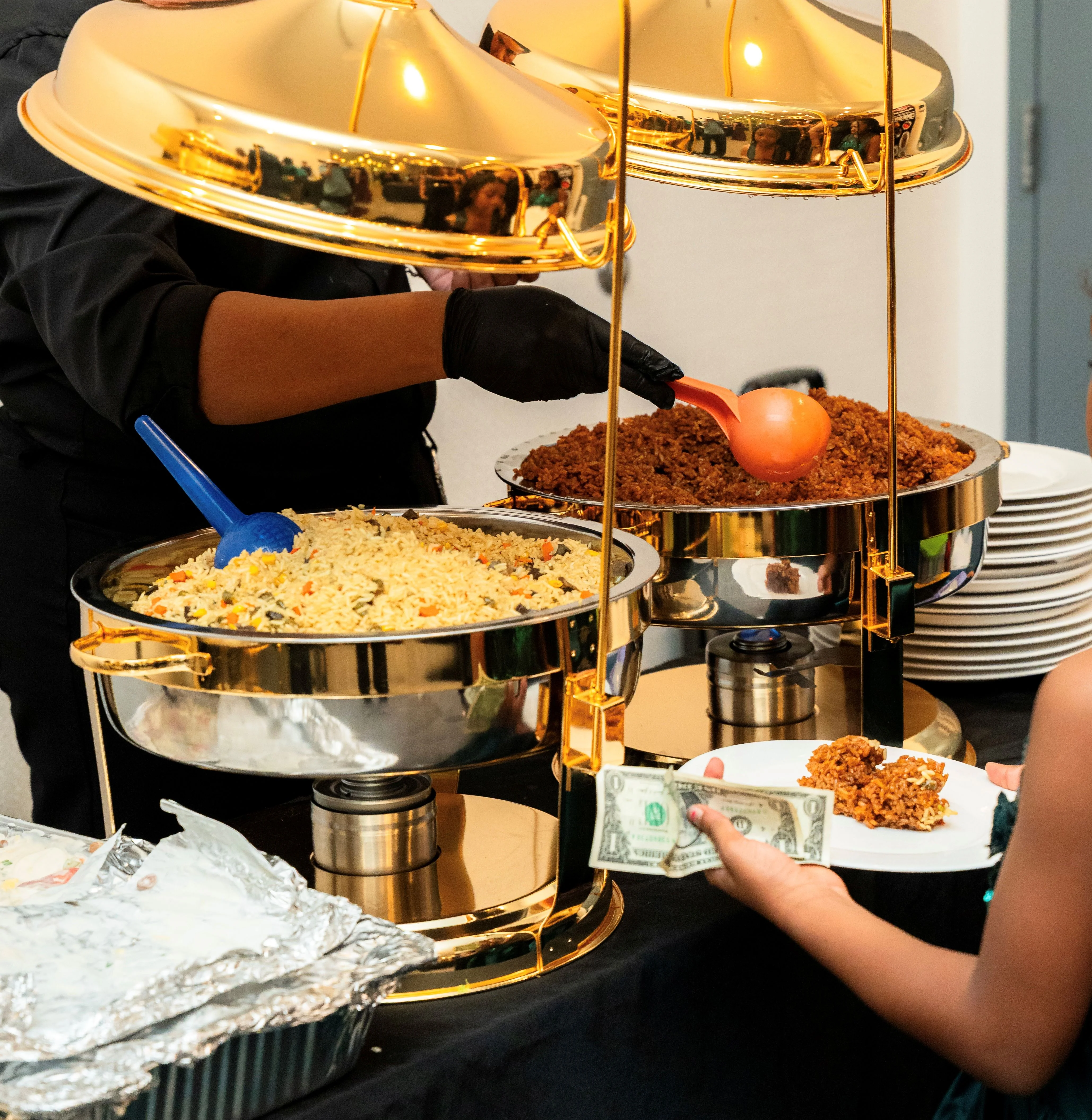 Catering station with flavorful biryani and spiced meat
