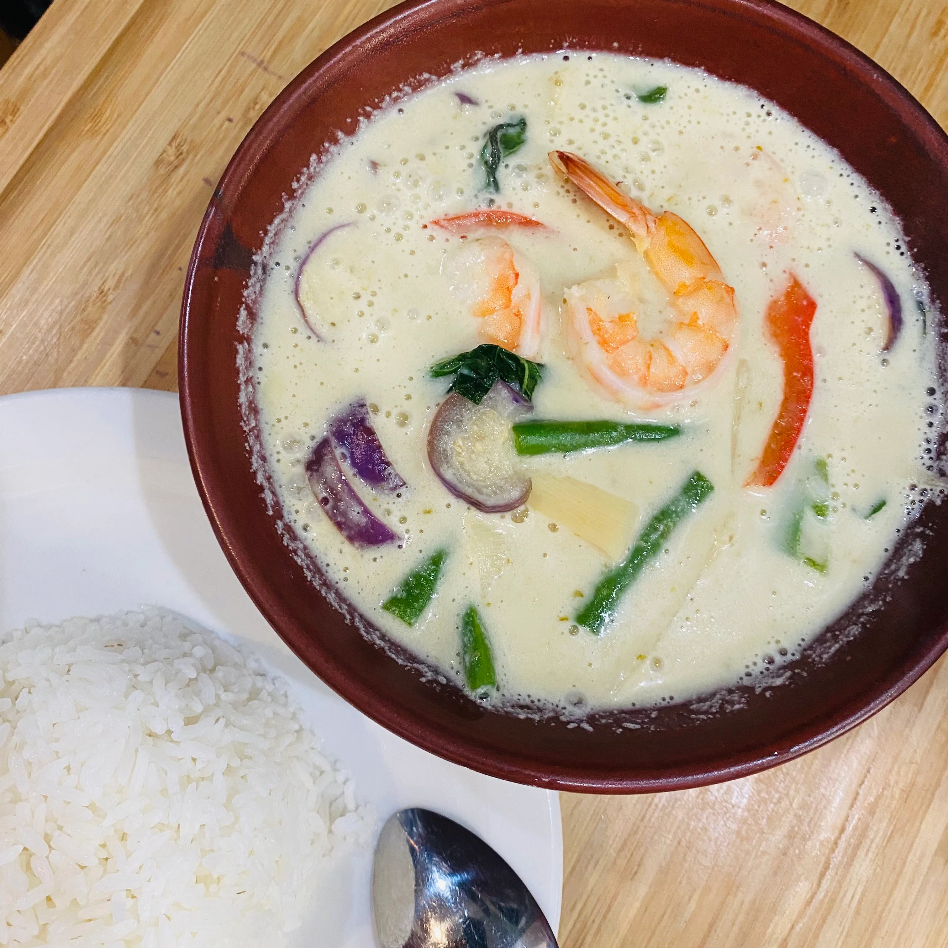 Thai tom yum soup with shrimp and herbs
