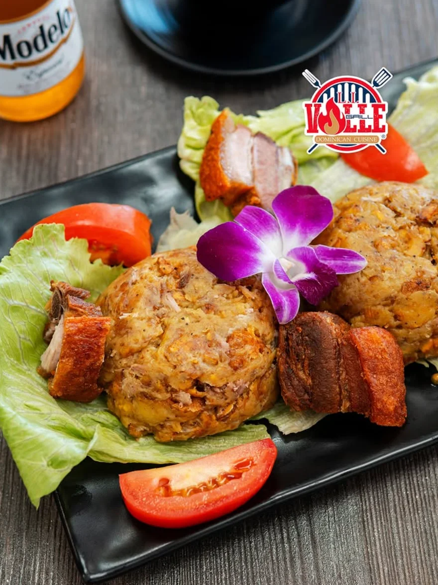 Dominican mofongo served with crispy pork and fresh vegetables