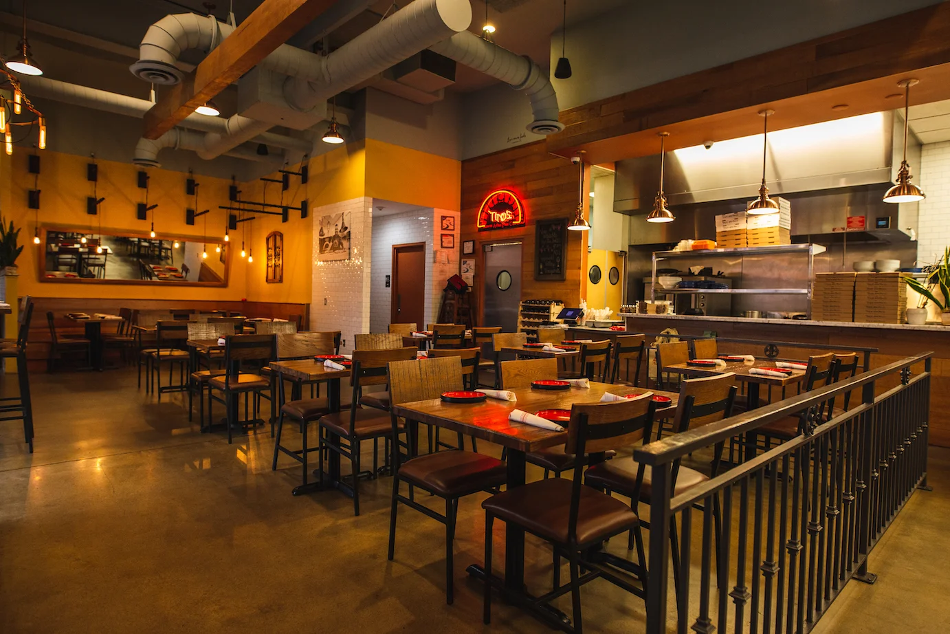 Cozy restaurant interior with wooden decor and warm lighting
