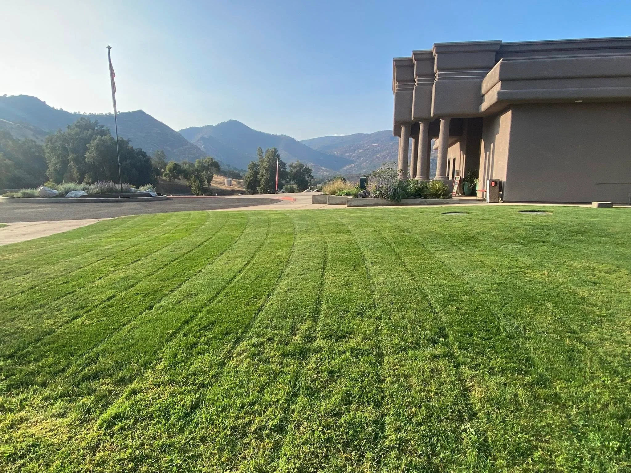 Well-manicured lawn with mountains in the background