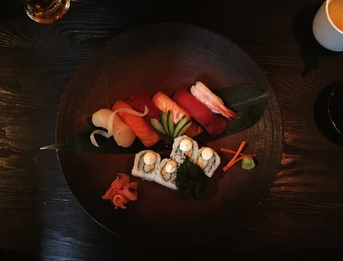 Assorted Japanese sushi platter with fresh fish and garnishes