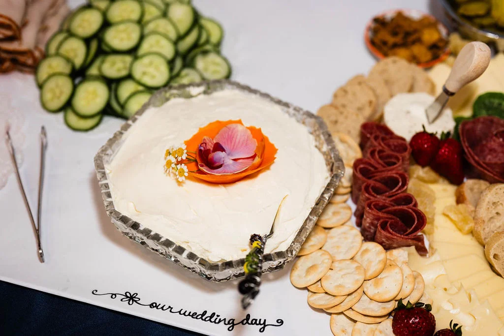 Elegant wedding charcuterie board with assorted meats and cheeses
