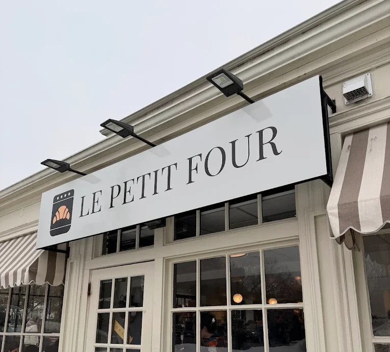 Exterior view of Le Petit Four restaurant showcasing its charming facade.